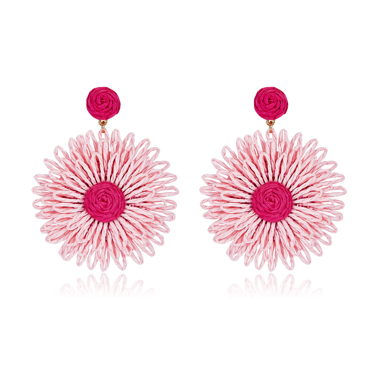 Large woven daisy-shaped earrings called Pink Bloom Drops, featuring light pink petals and a bright magenta center.