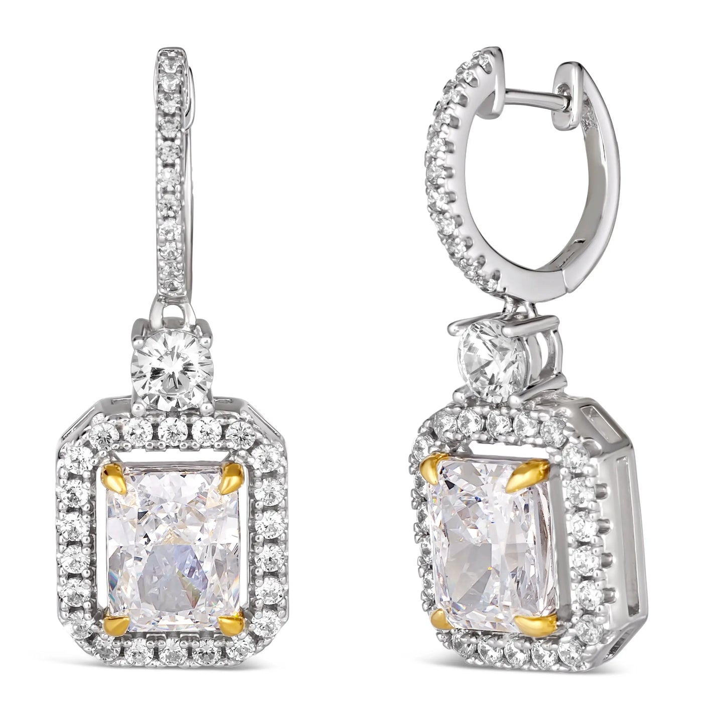 Anna Zuckerman Harper Radiant Huggies in White Diamond feature radiant-cut white diamonds with a crystalline halo in sterling silver. Elegant 1-inch huggie earrings with gold prong accents, perfect for luxury jewelry collections.