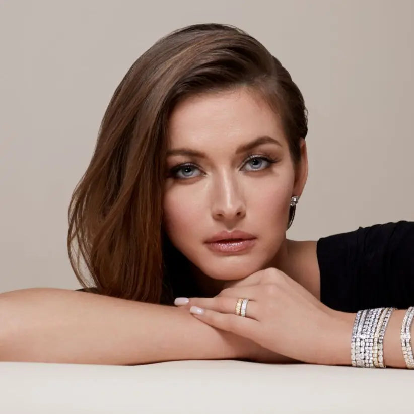 Model wearing Anna Zuckerman Mini Pebble Band in Platinum, styled with matching diamond jewelry for an elegant and sophisticated look.