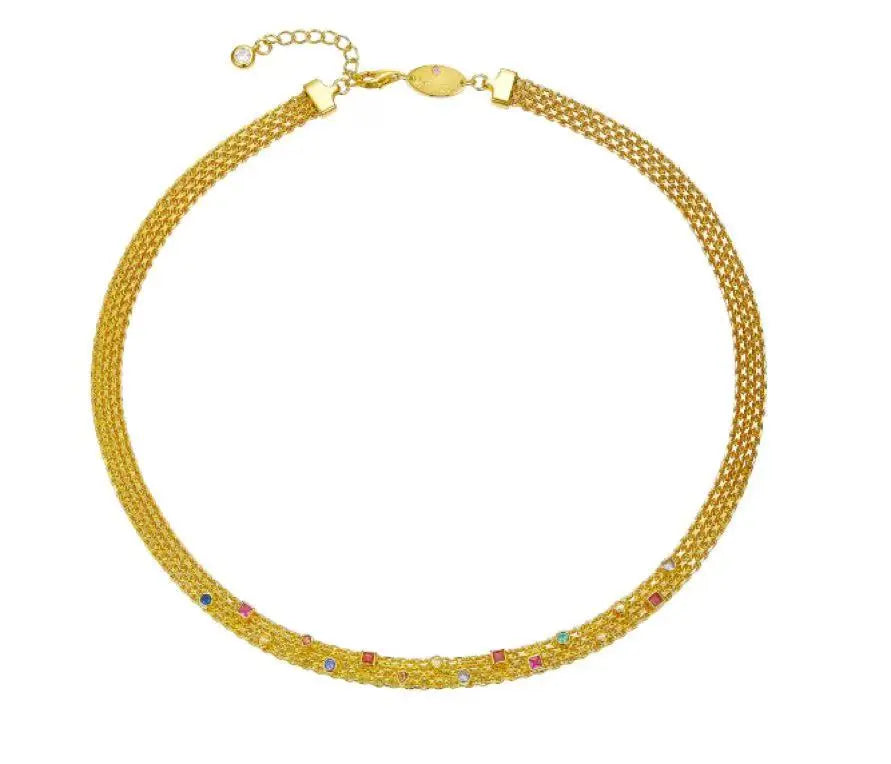 Gold necklace with multicolored stones on a white background
