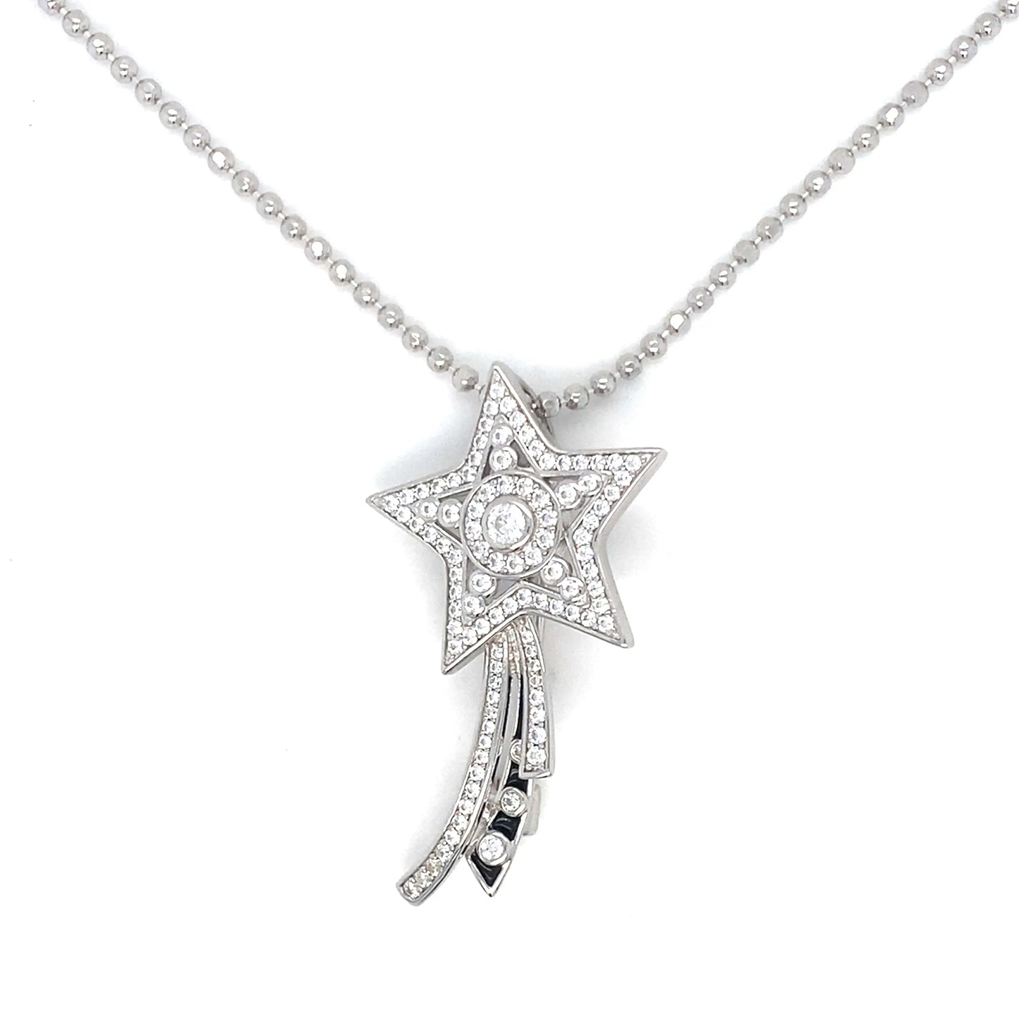 Star-shaped diamond pendant on a chain against a white background