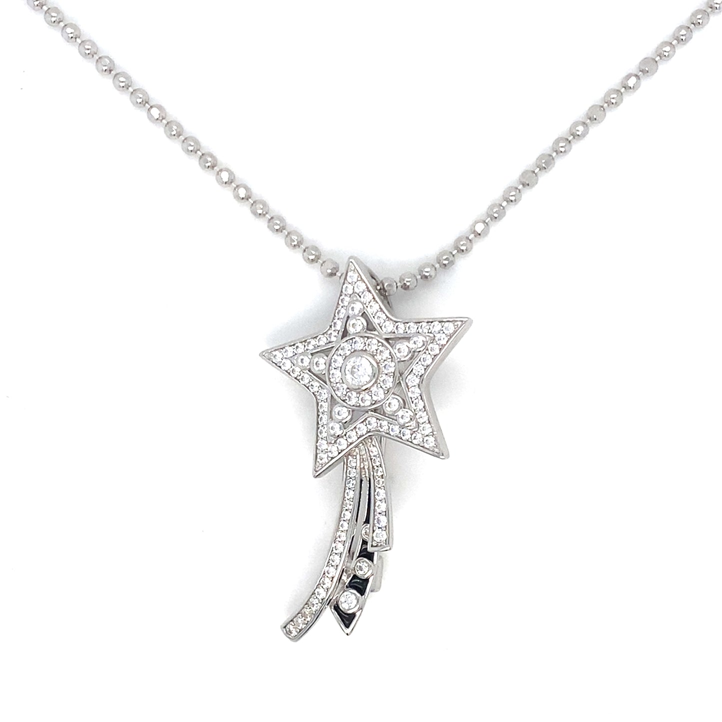 Star-shaped diamond pendant on a chain against a white background