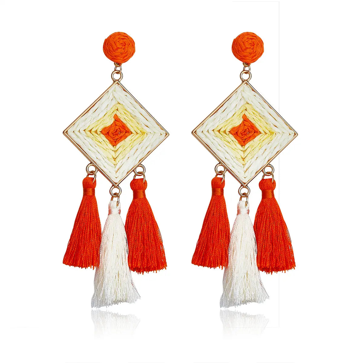 Diamond-shaped woven earrings in orange and ivory with tassel drops, named Sunset Tango Drops.