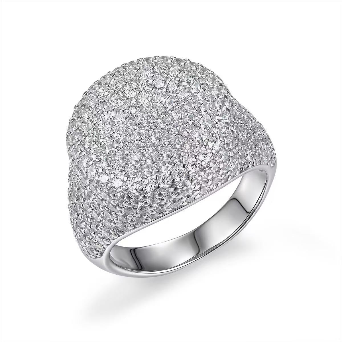 Silver ring with a textured surface on a white background