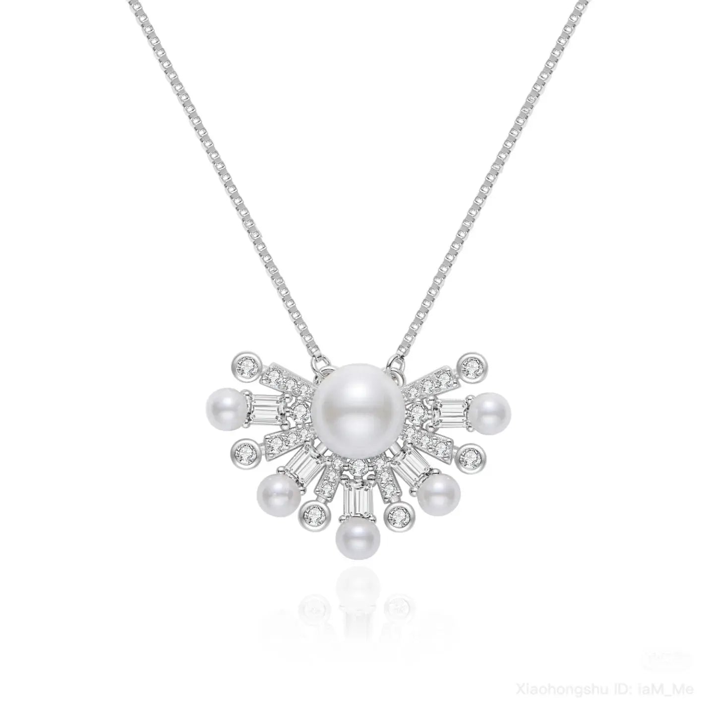 Pearl necklace with silver chain on a white background