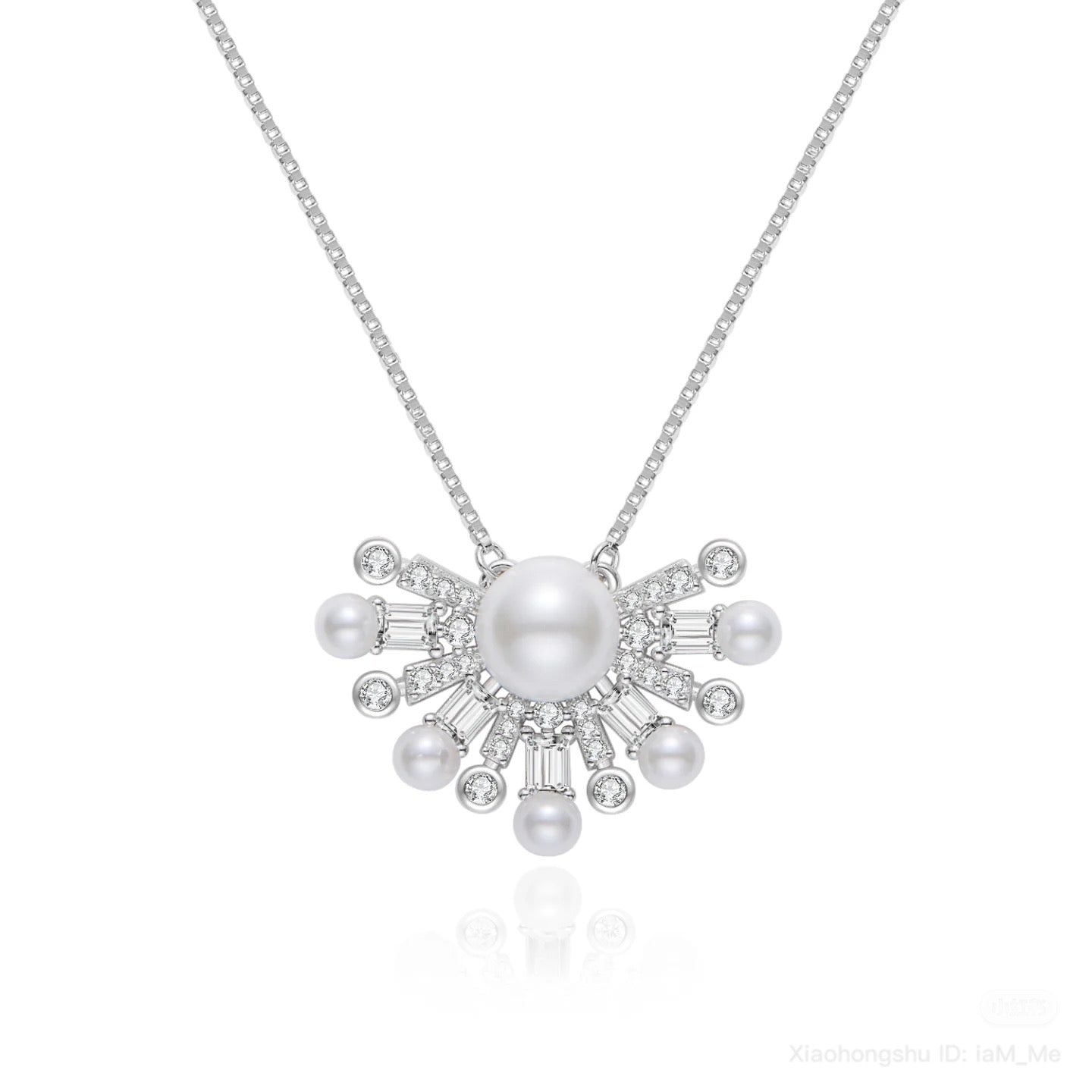 Pearl necklace with silver chain on a white background