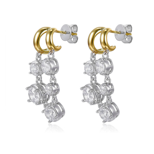 Pair of earrings with gold and silver loops on a white background