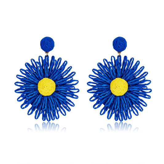 Sapphire blue woven flower earrings with a bright yellow center, named Sapphire Sunshine Blooms.
