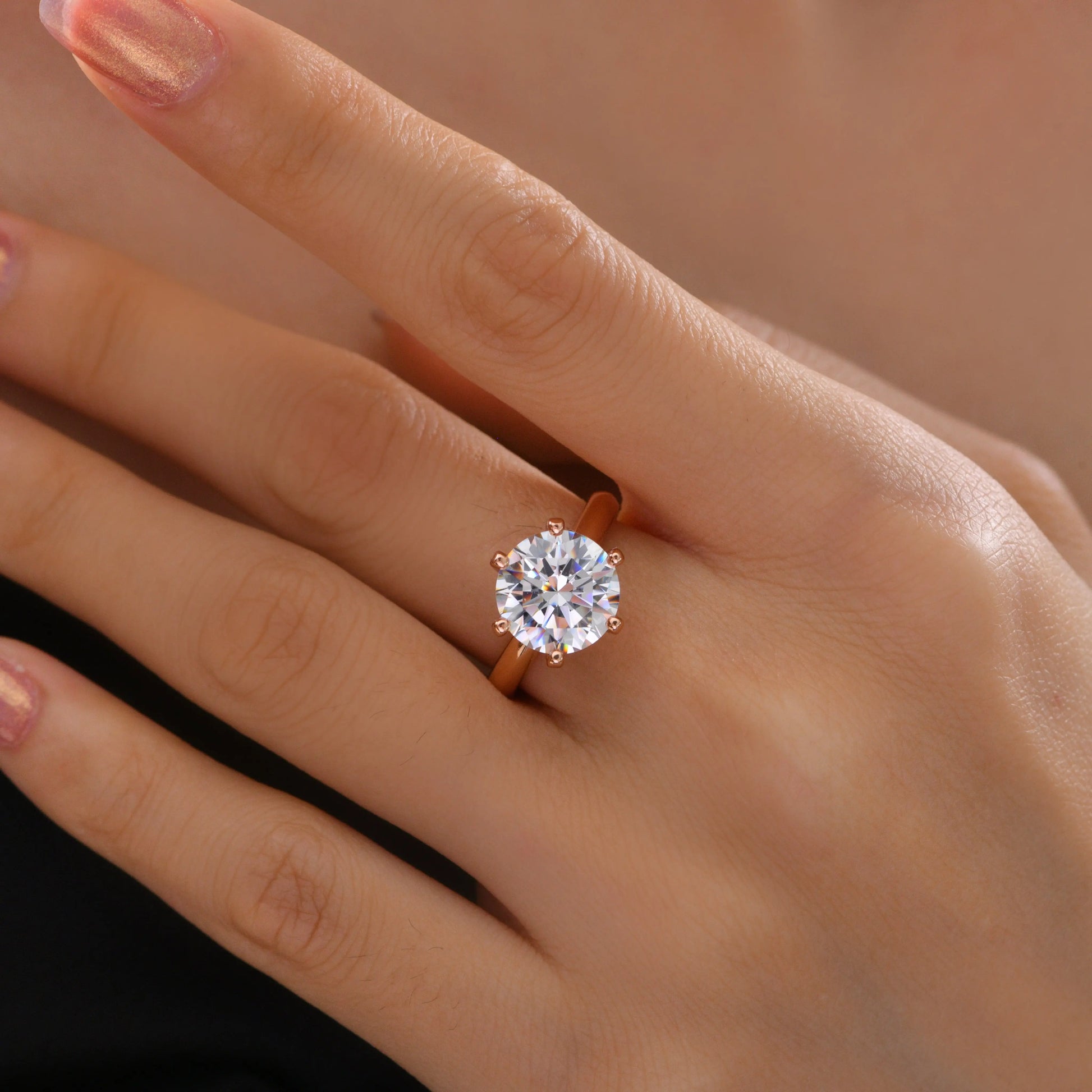 Anna Zuckerman 4 Carat Solitaire Engagement Ring featuring a brilliant lab-created diamond in a six-prong 18k rose gold setting. Elegant and dainty design ideal for weddings or proposals.