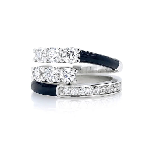 Set of three diamond rings with black and silver bands on a white background