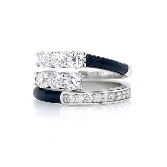 Set of three diamond rings with black and silver bands on a white background