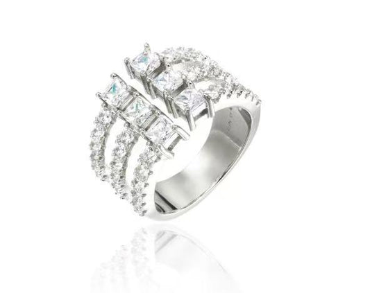 Silver ring with multiple diamonds on a white background