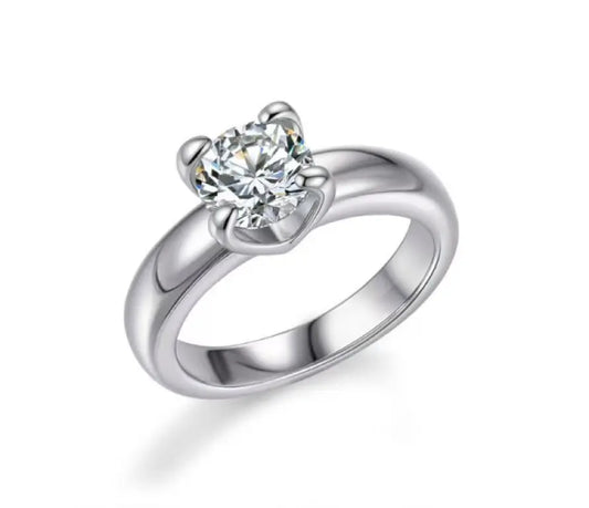 Silver ring with a diamond on a white background