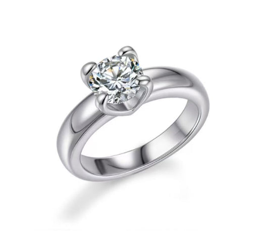 Silver ring with a diamond on a white background