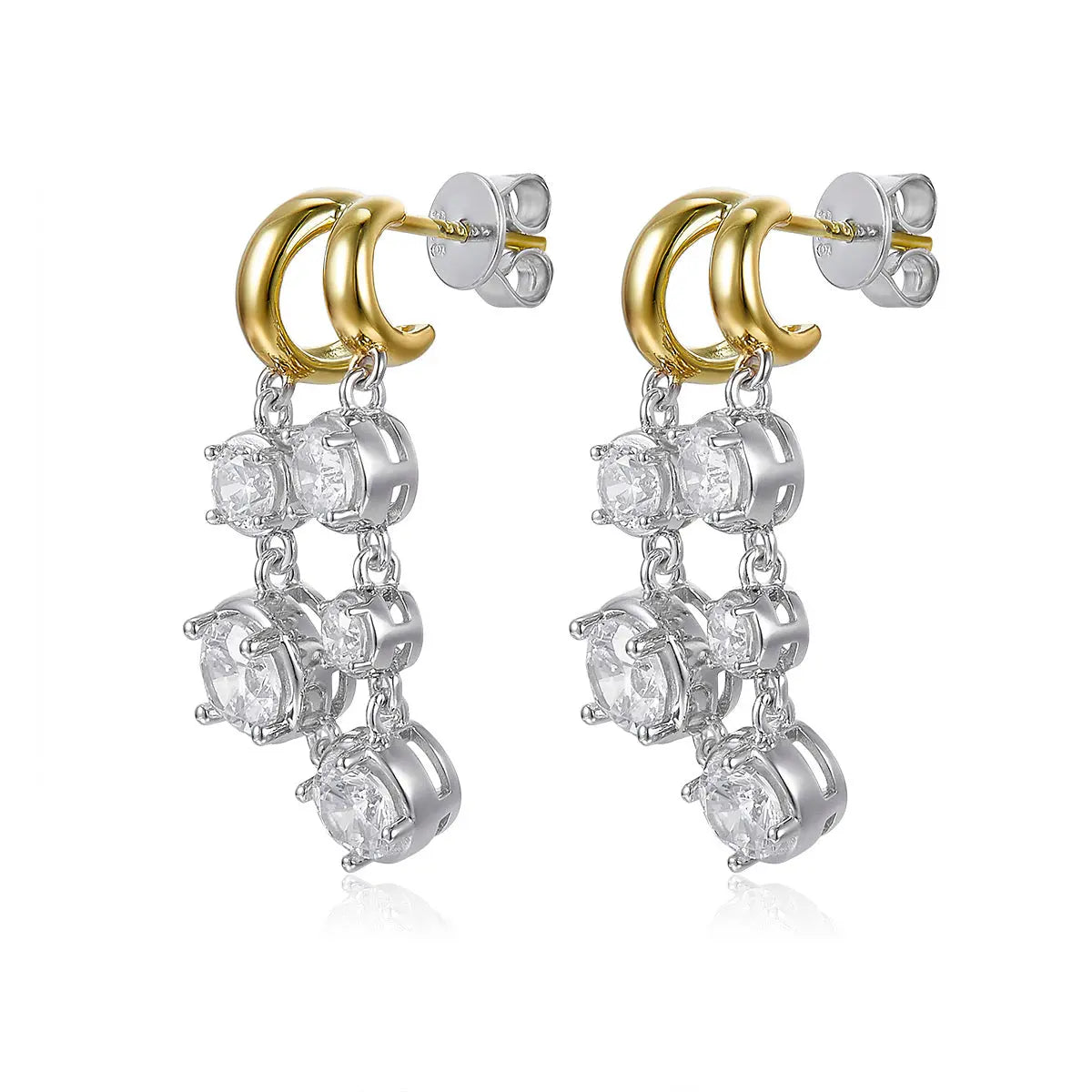 Pair of earrings with gold and silver loops on a white background