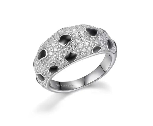 Silver ring with black stones on a white background