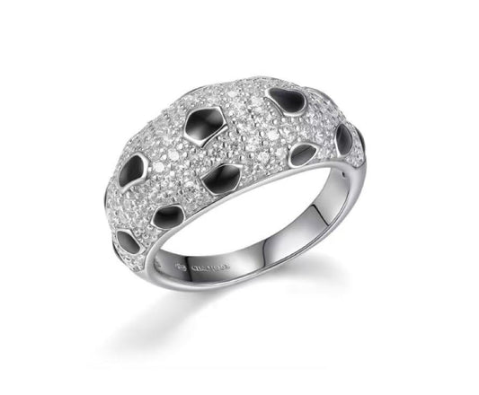 Silver ring with black stones on a white background