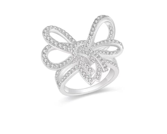 Silver butterfly ring with clear stones on a white background
