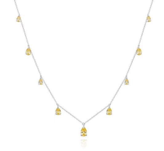 Necklace with small yellow pendants on a white background