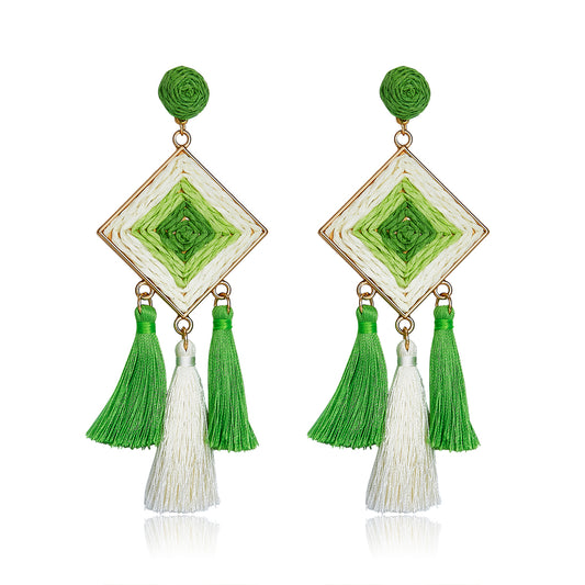 Diamond shaped woven earrings in green and ivory with tassel drops, named Emerald Breeze Drops.