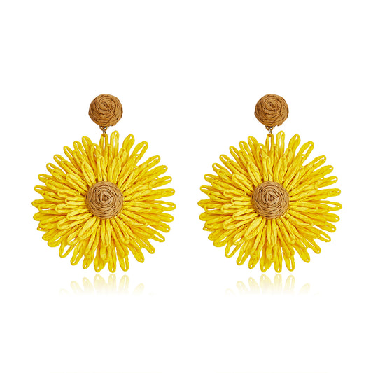 Bright yellow woven flower earrings with a tan center, named Golden Meadow Blooms.