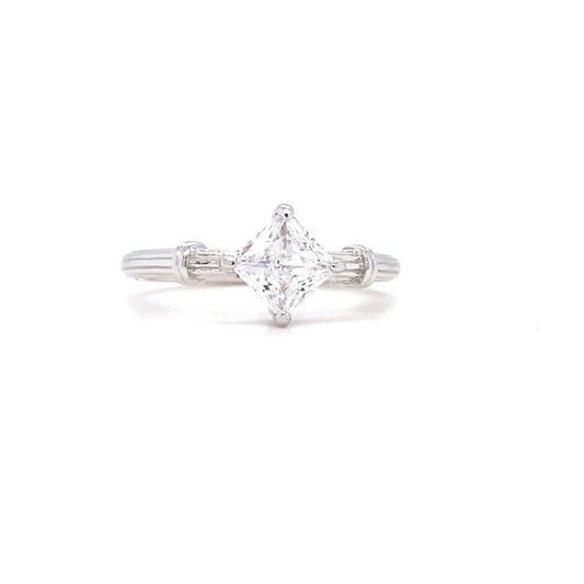 Diamond ring with a triangular stone on a white background