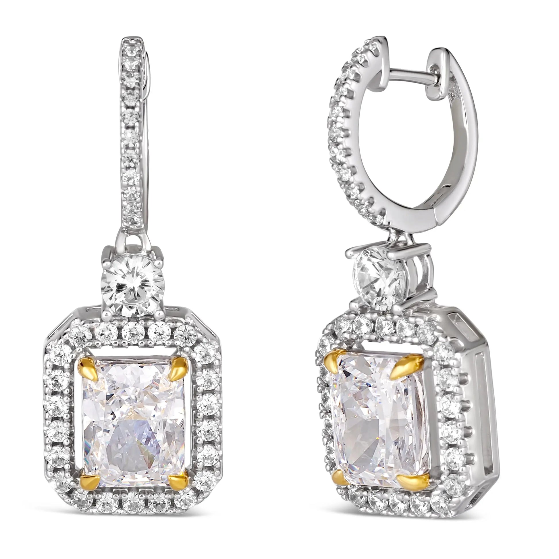 Anna Zuckerman Harper Radiant Huggies in White Diamond feature radiant-cut white diamonds with a crystalline halo in sterling silver. Elegant 1-inch huggie earrings with gold prong accents, perfect for luxury jewelry collections.