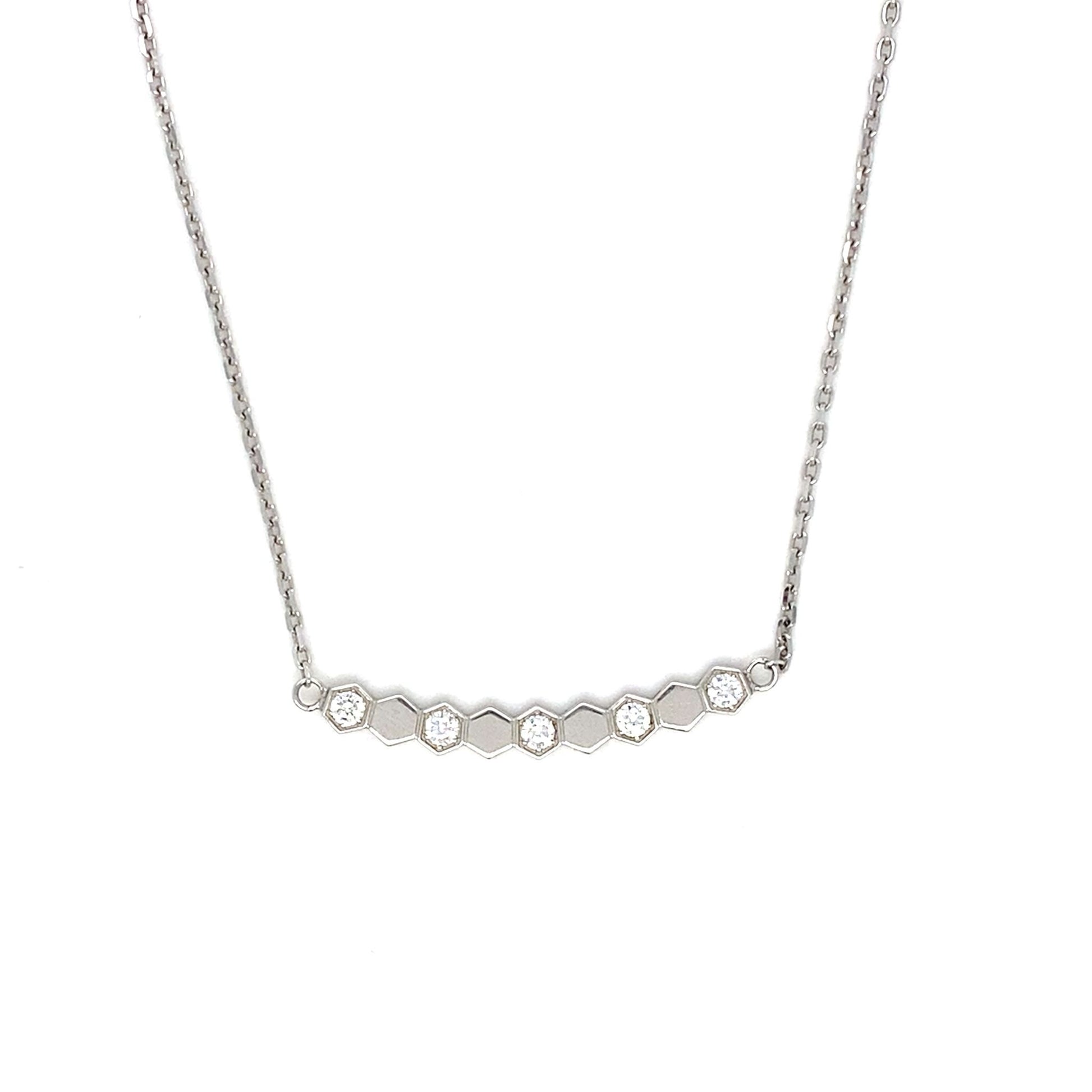 Silver necklace with small diamonds on a white background