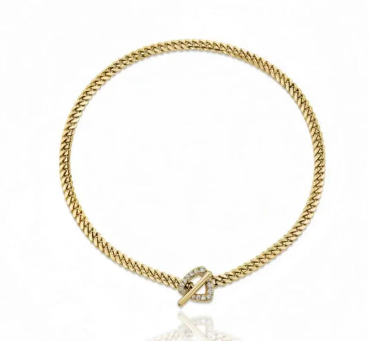 Gold bracelet with a clasp on a white background
