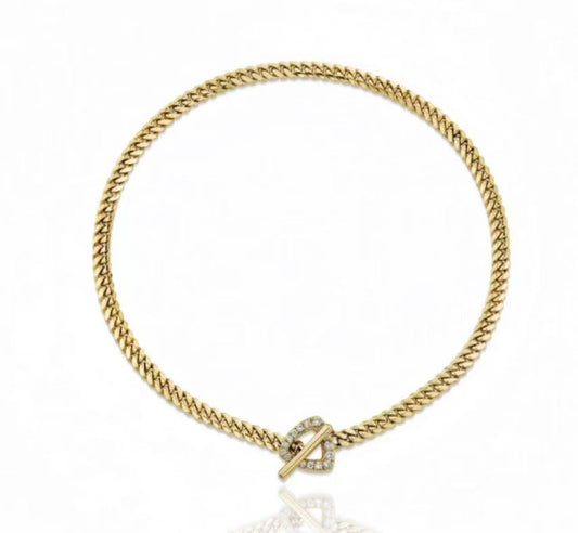 Gold bracelet with a clasp on a white background