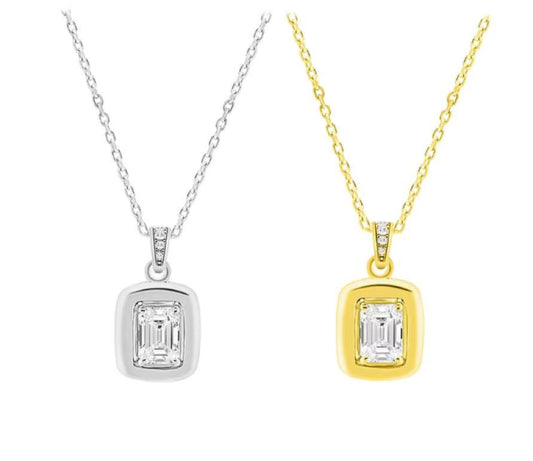 Two diamond pendants, one silver and one gold, on white background