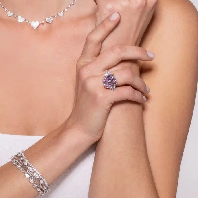Model wearing Anna Zuckerman Malibu 10 Carat Diamond Crystalline Ring in blue sapphire with platinum-plated setting. Bold cocktail ring for statement looks.