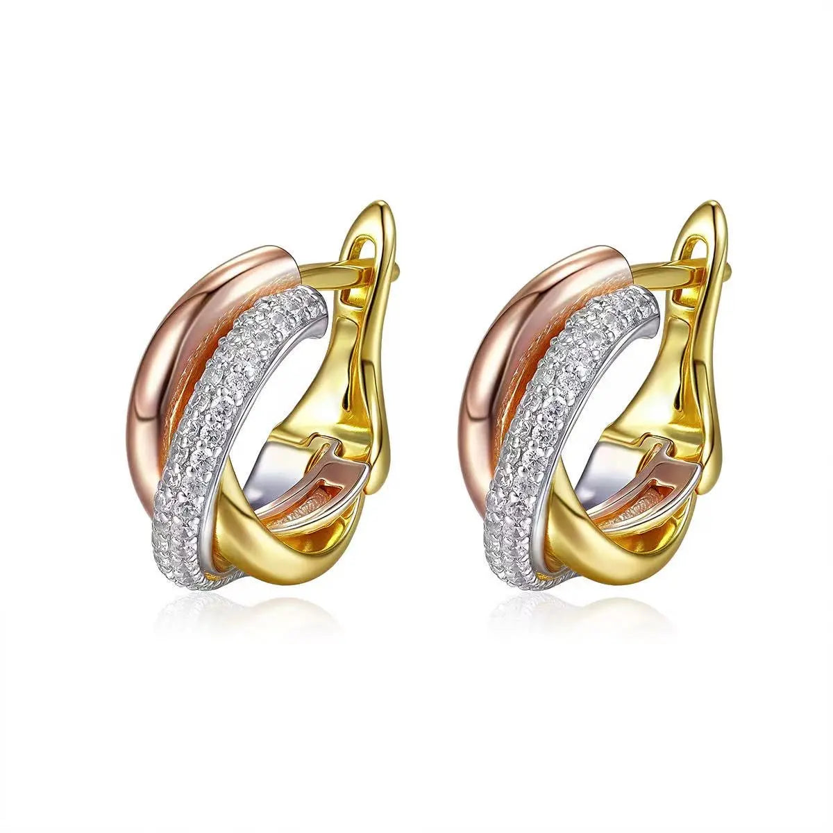 Pair of gold and rose gold hoop earrings with diamond accents on a white background