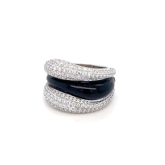 Stack of three rings with glittery silver bands and a black band on a white background