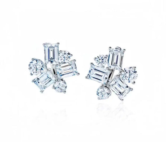 Pair of diamond earrings on a white background