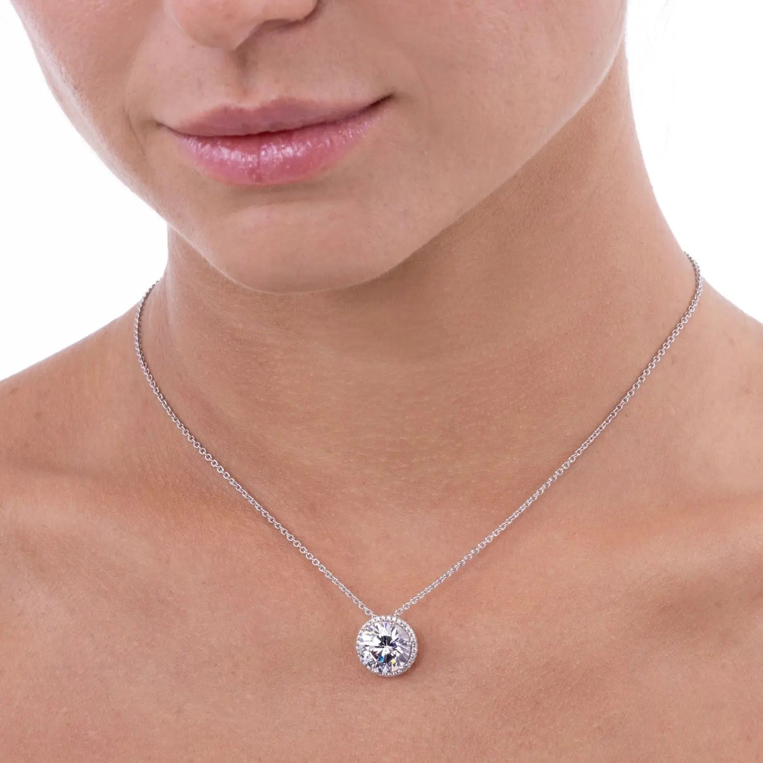 Anna Zuckerman Perfect Halo 5 Carat Diamond Crystalline Necklace featuring a round 5ct lab-created stone in a platinum-finished sterling silver halo setting. Elegant pendant design ideal for layering or solo wear in fine jewelry collections.
