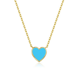 Gold necklace with a blue heart pendant on a white background