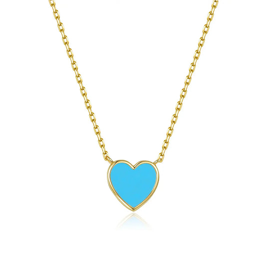 Gold necklace with a blue heart pendant on a white background