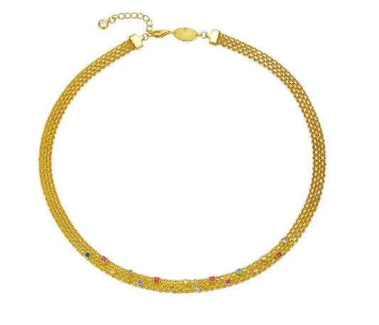 Gold necklace with multicolored stones on a white background