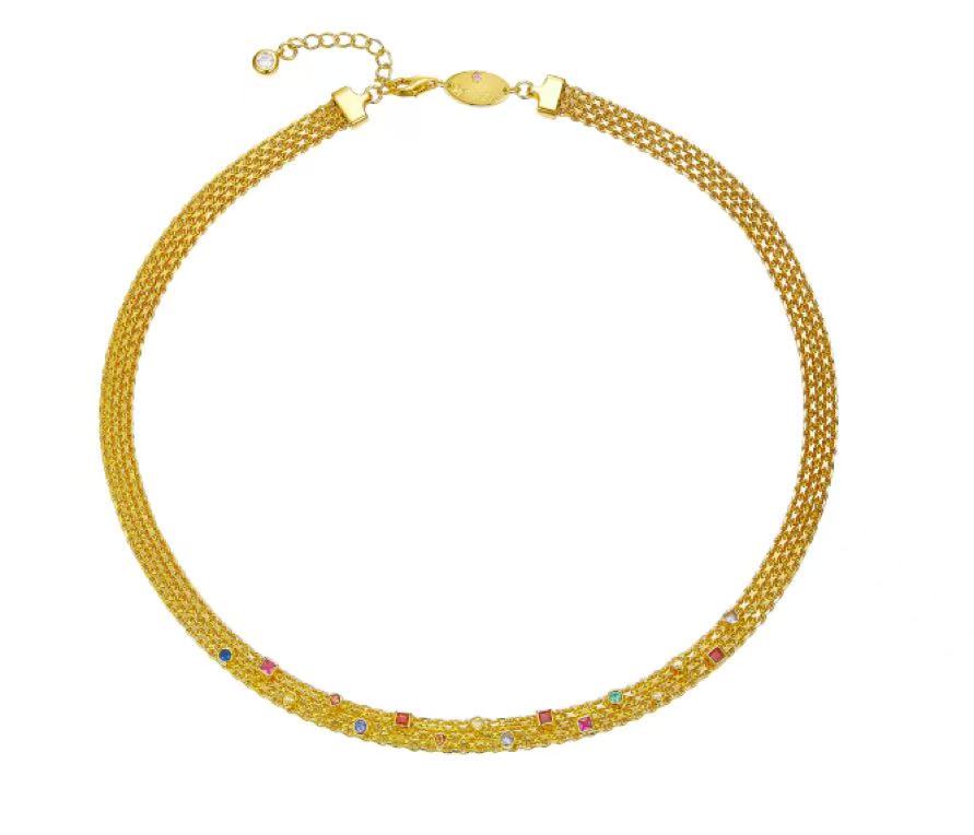 Gold necklace with multicolored stones on a white background