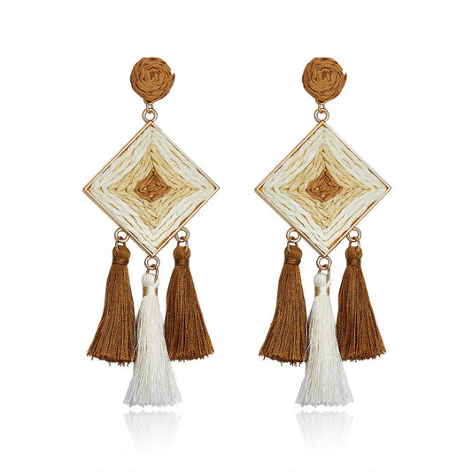 Camel brown and cream diamond-shaped woven earrings with silky tassels.