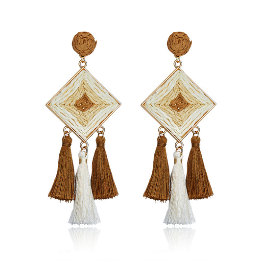 Camel brown and cream diamond-shaped woven earrings with silky tassels.