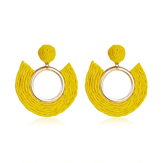 Sunflower yellow half-moon woven earrings with central gold ring.