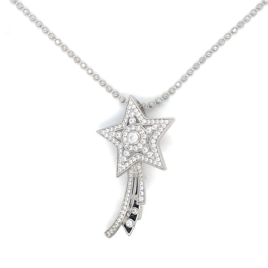 Star-shaped diamond pendant on a chain against a white background