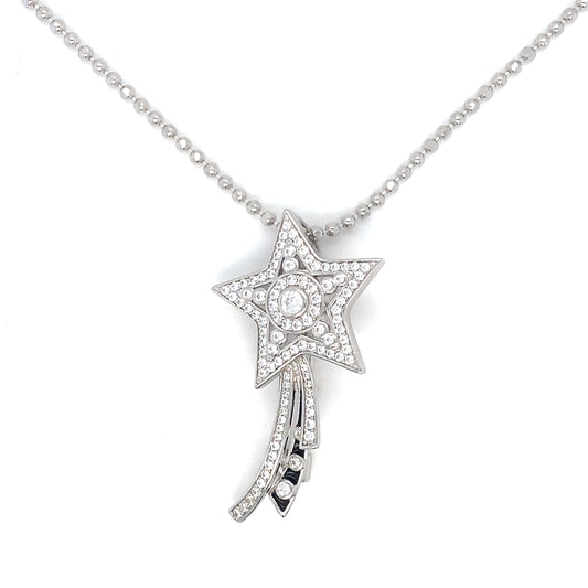 Star-shaped diamond pendant on a chain against a white background
