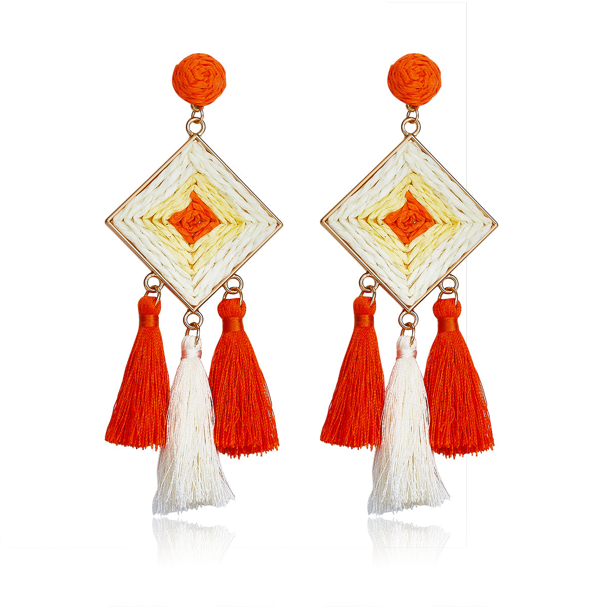 Diamond-shaped woven earrings in orange and ivory with tassel drops, named Sunset Tango Drops.