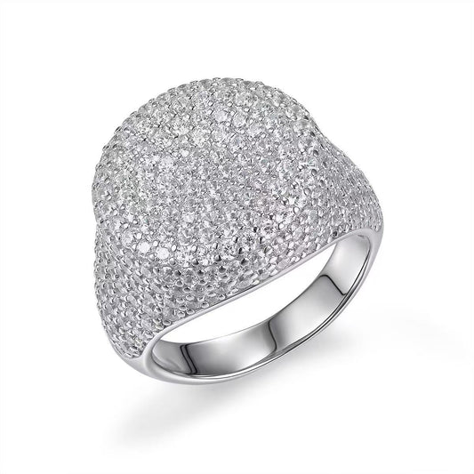 Silver ring with a textured surface on a white background