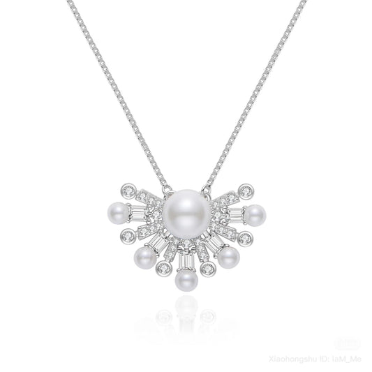Pearl necklace with silver chain on a white background