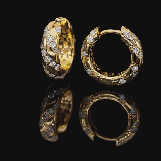 Gold hoop earrings with diamond accents on a white background