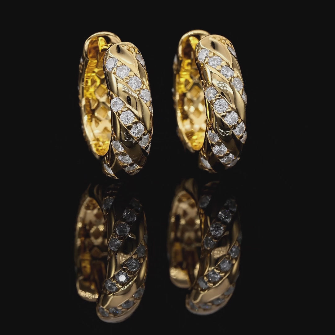 Gold hoop earrings with diamond accents on a white background